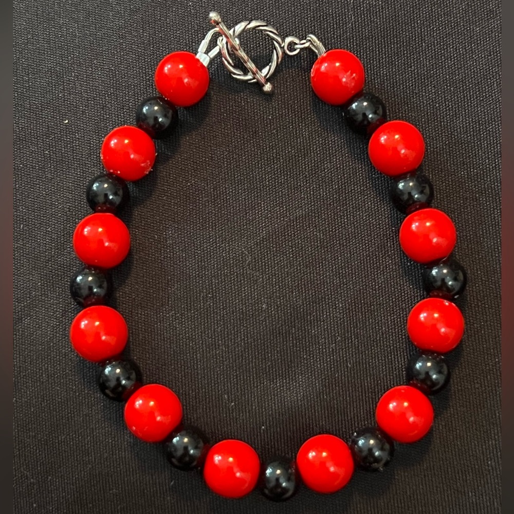 Red & black handcrafted bracelets.